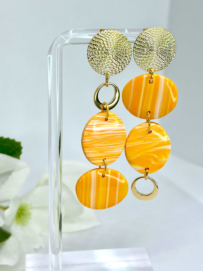 Long Asymmetrical Earrings with Orange Rounds and Gold Accents
