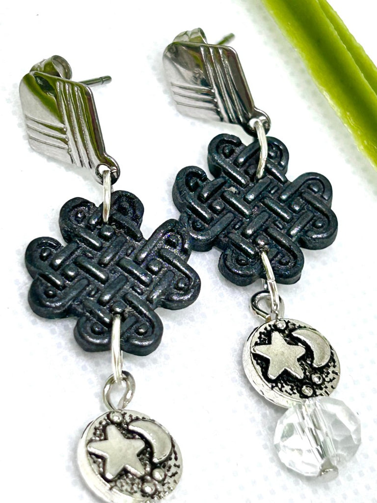 Earrings with black polymer clay celtic charms, silver star and moon and glass beads