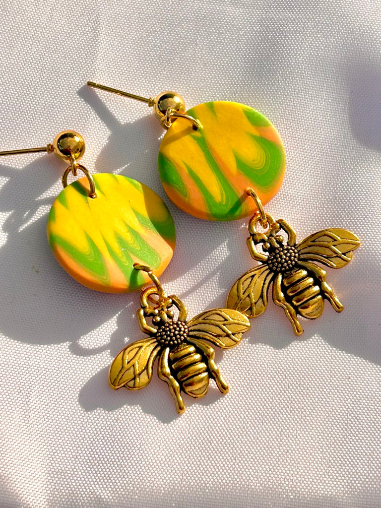 citrus swirl polymer clay earrings with gold honeybee charms