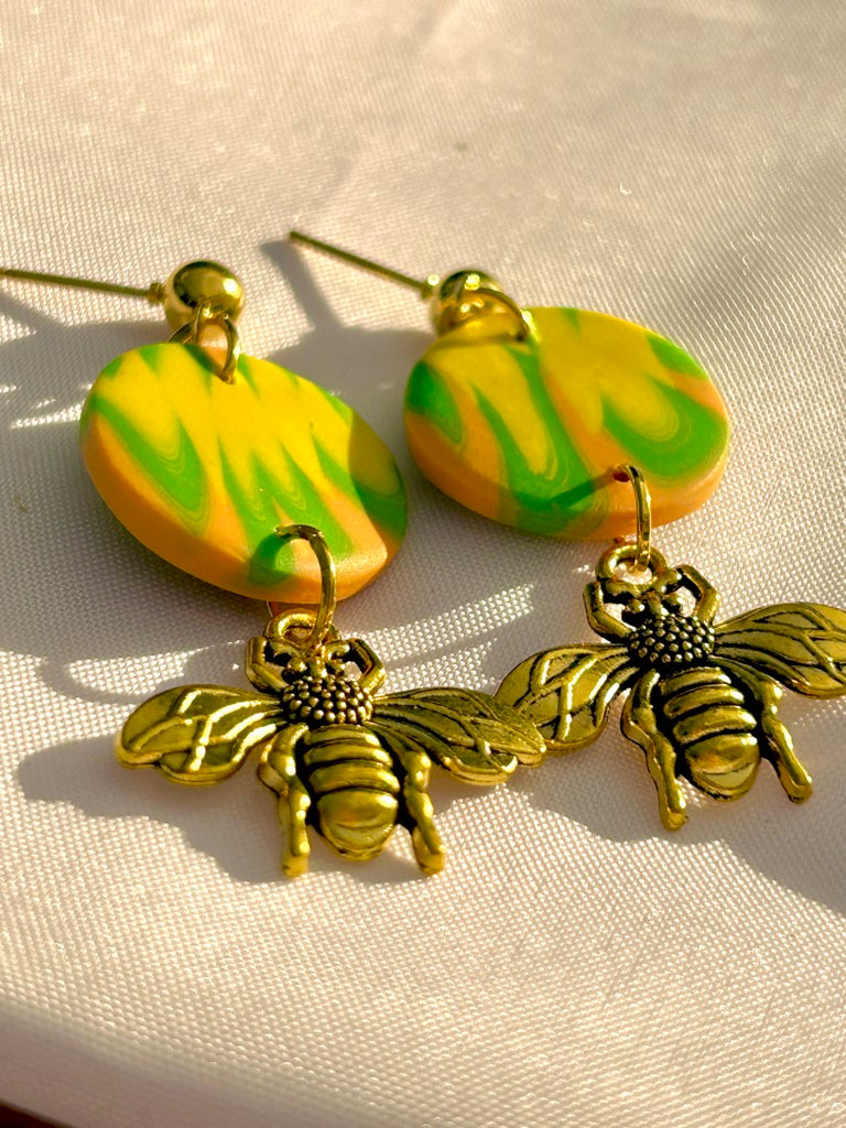 citrus swirl polymer clay earrings with gold honeybee charms