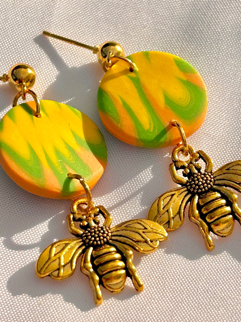 citrus swirl polymer clay earrings with gold honeybee charms