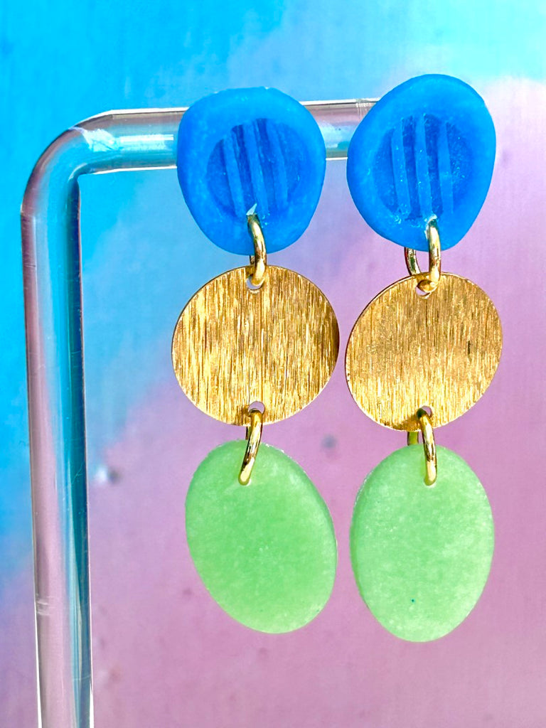 blue, gold, and green handmade polymer clay earrings with circular and oval shapes