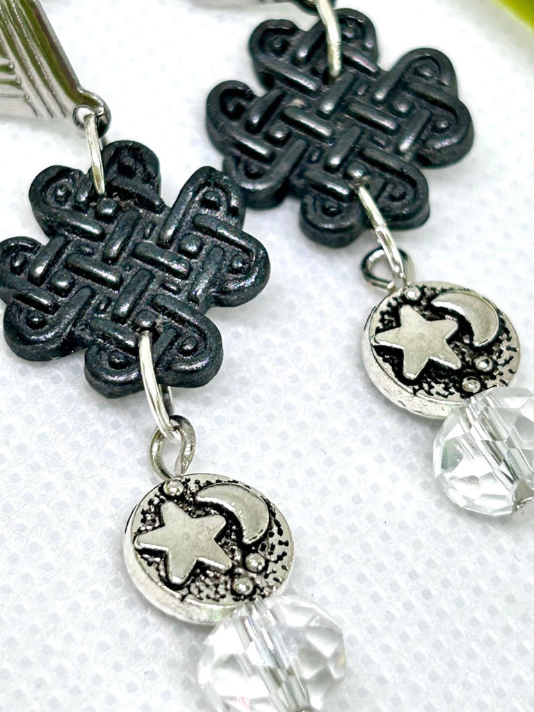 Earrings with black polymer clay celtic charms, silver star and moon and glass beads