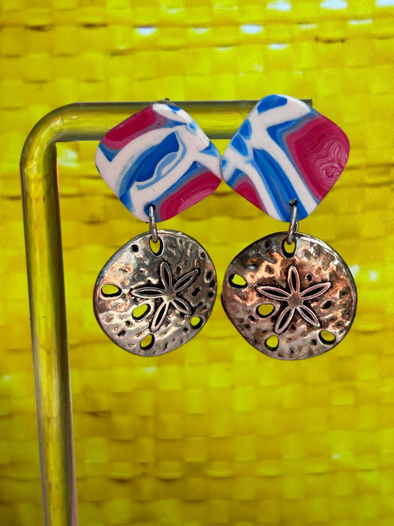 A pair of ocean-themed polymer clay earrings in red, white, and blue