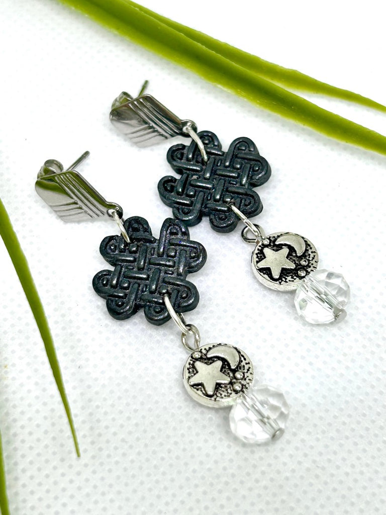 Earrings with black polymer clay celtic charms, silver star and moon and glass beads