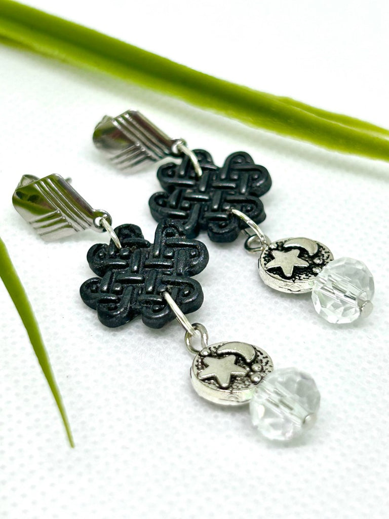 Earrings with black polymer clay celtic charms, silver star and moon and glass beads